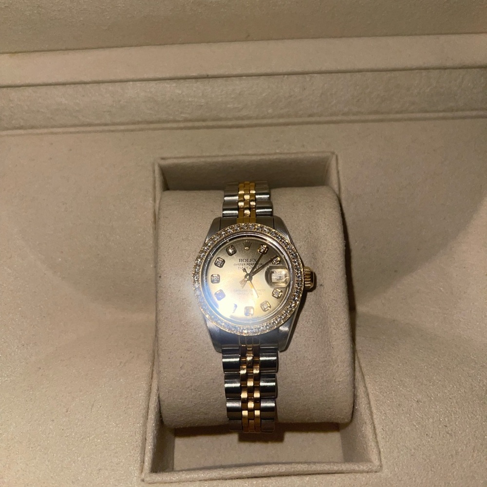Women’s 26mm Rolex with diamond bezel.
